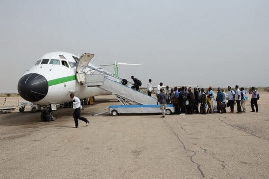 a group of people boarding an airplane