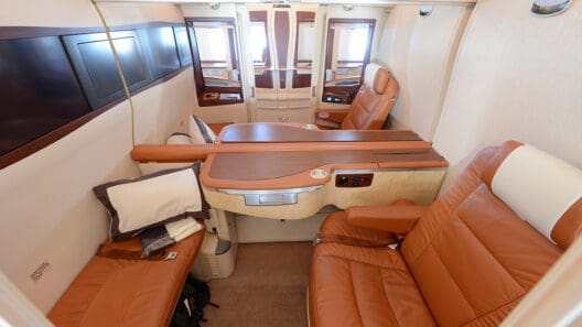 a room with leather chairs and a table