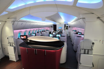 a room with rows of monitors on the side of the plane