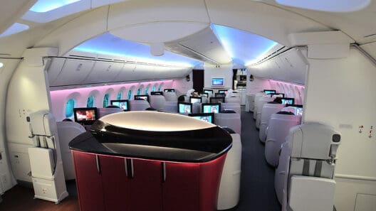 a room with rows of monitors on the side of the plane