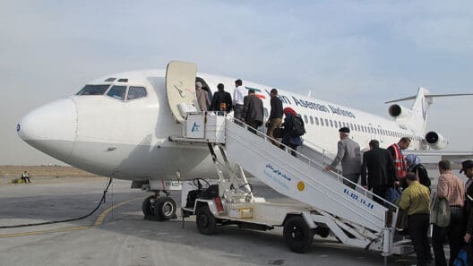 a group of people boarding an airplane