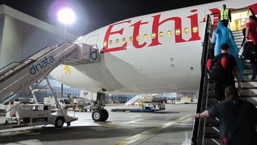 a group of people boarding an airplane