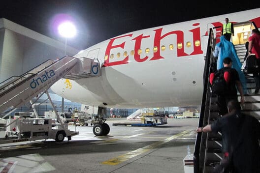 a group of people boarding an airplane