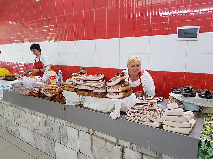 Russian selling pork inside Osh Bazaar, Bishkek, Kyrgyzstan