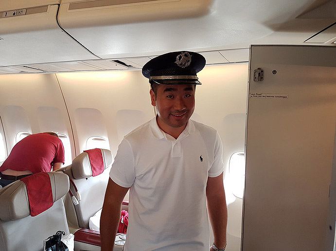 a man in a uniform on an airplane