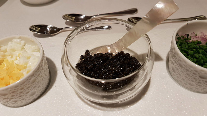 a bowl of black caviar