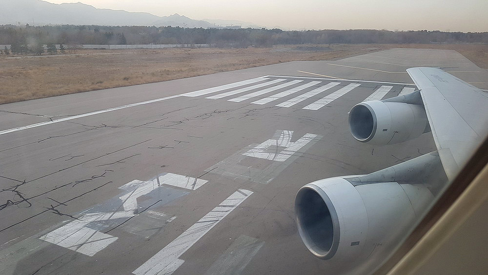 an airplane wing on a runway