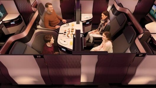 a family sitting at a table in a plane