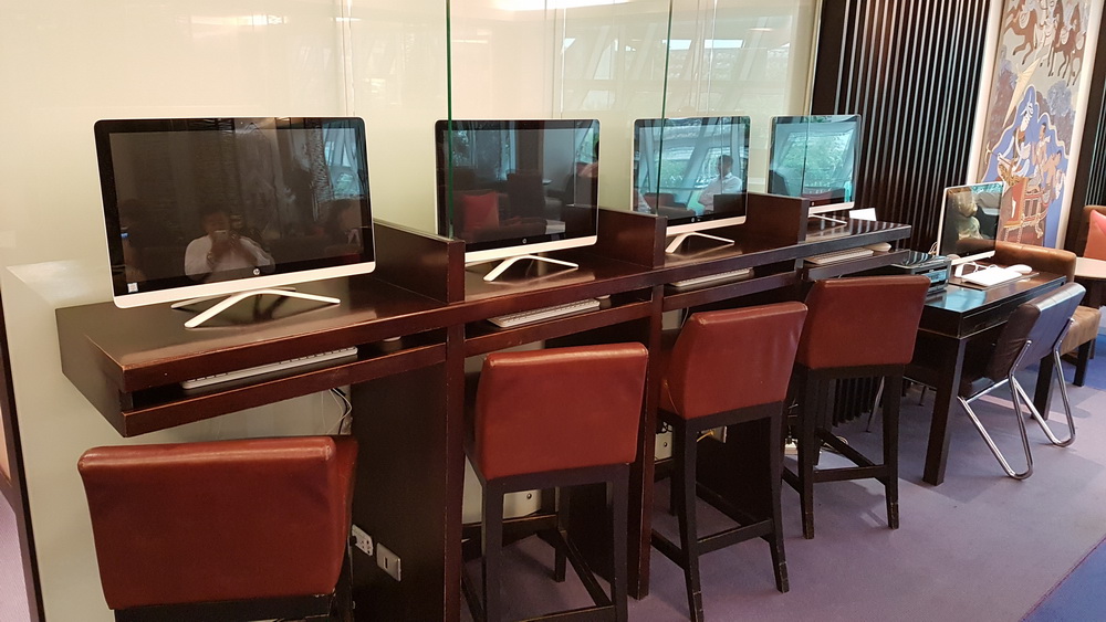 a row of computers on a table
