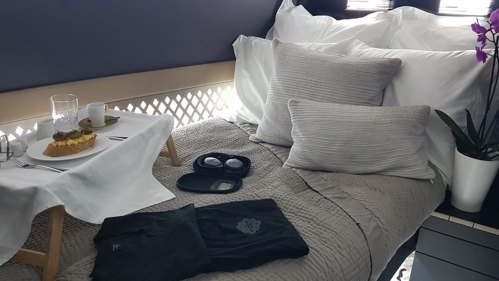 a bed with pillows and a case on it