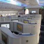 a plane with seats and screens