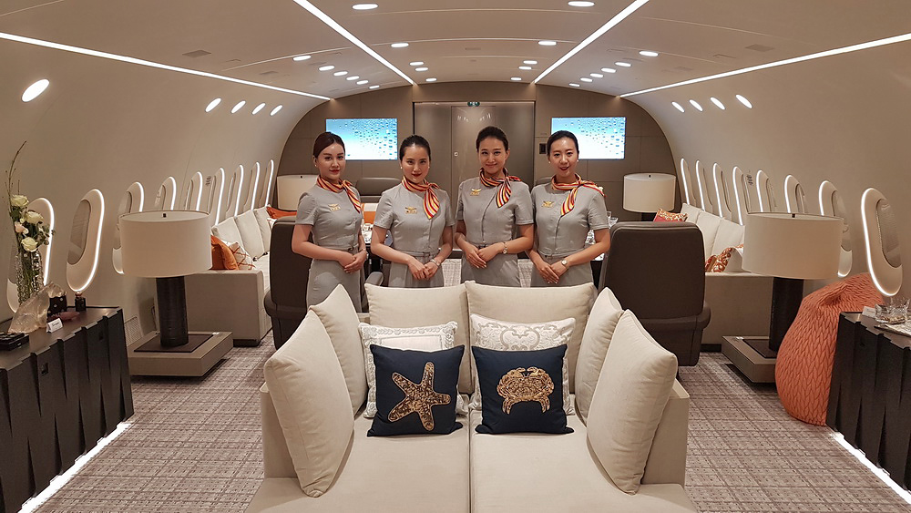 a group of women standing in a plane