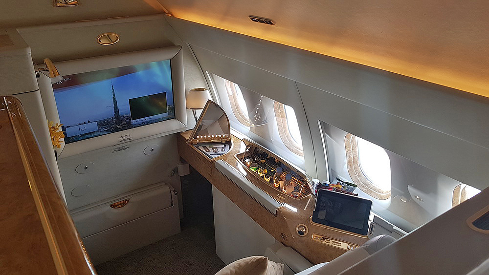 a tv and a table in an airplane