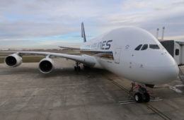 a large white airplane on a runway