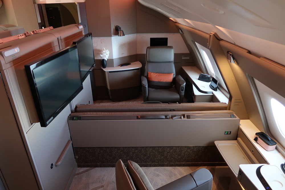 a plane with a desk and a chair