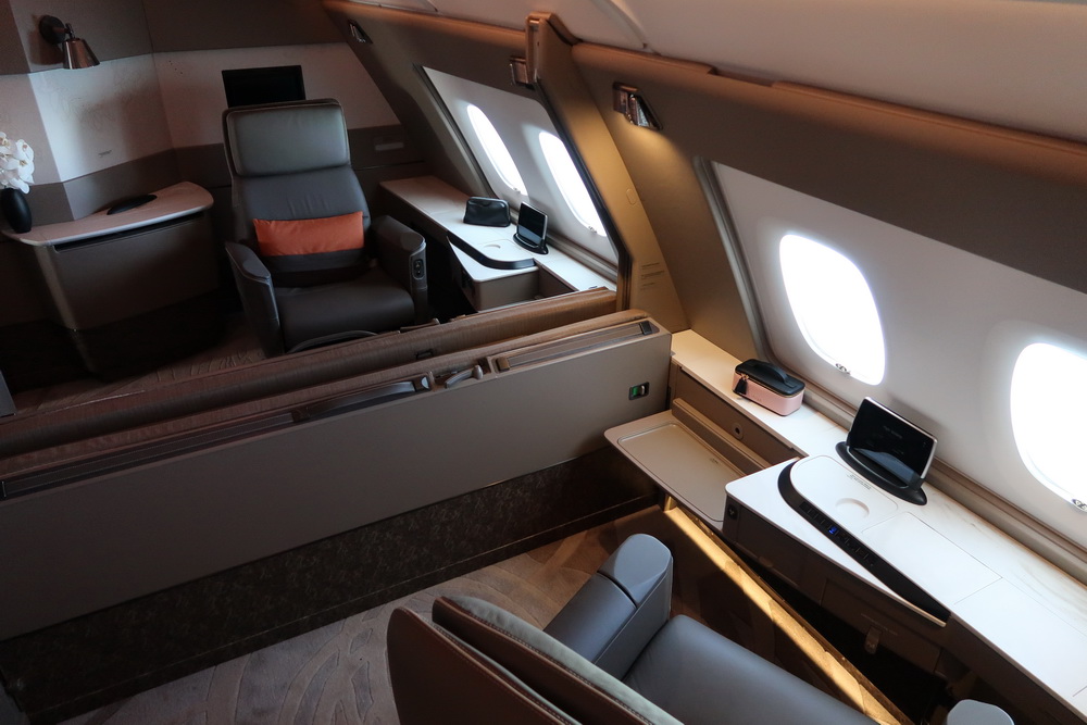 an airplane with a desk and chairs