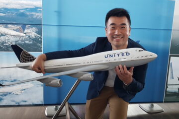 a man holding a model airplane