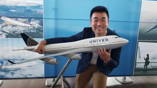 a man holding a model airplane