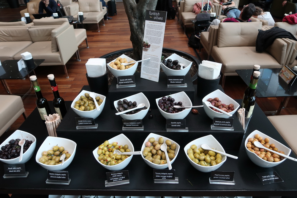 a table with bowls of olives