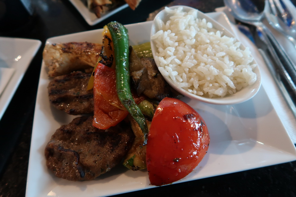 a plate of food with rice and meat