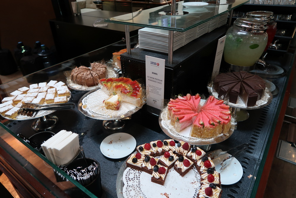 a display of cakes on plates