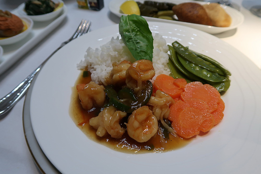 a plate of food with shrimp and vegetables