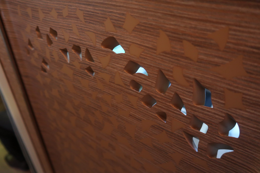 a wood surface with holes in it