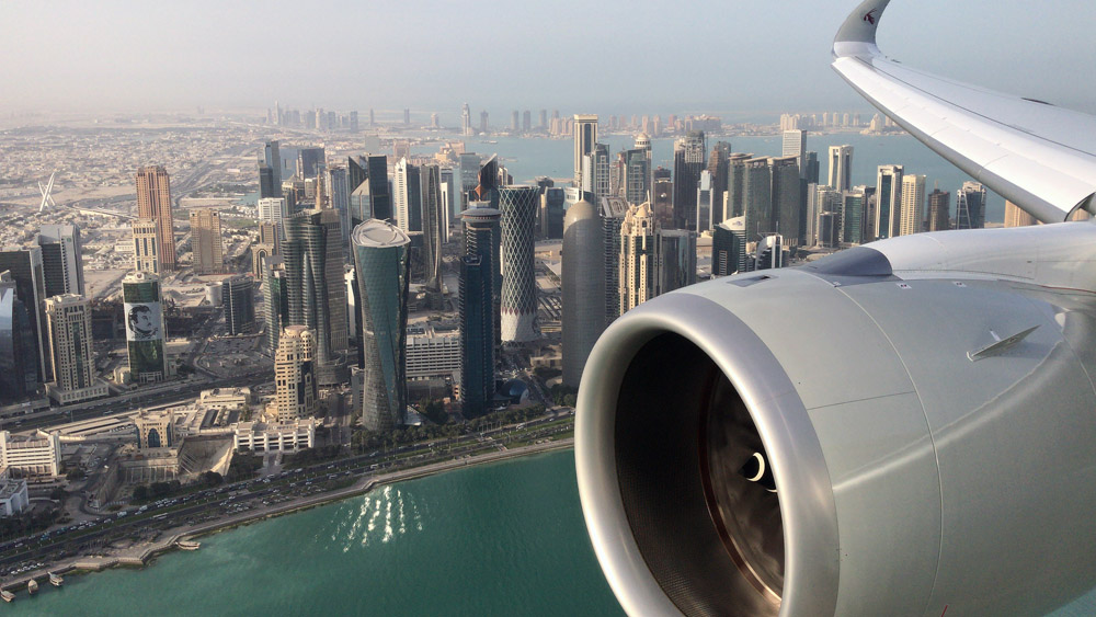 Qatar Airways Airbus A350-1000 flypass Doha skyline