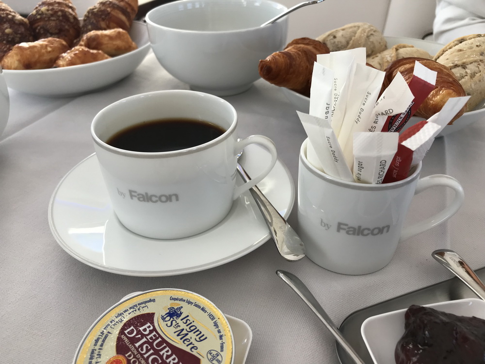 a coffee and croissants on a table