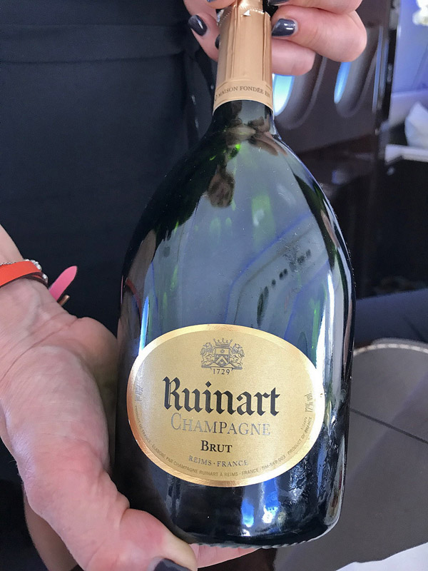 a person holding a bottle of champagne