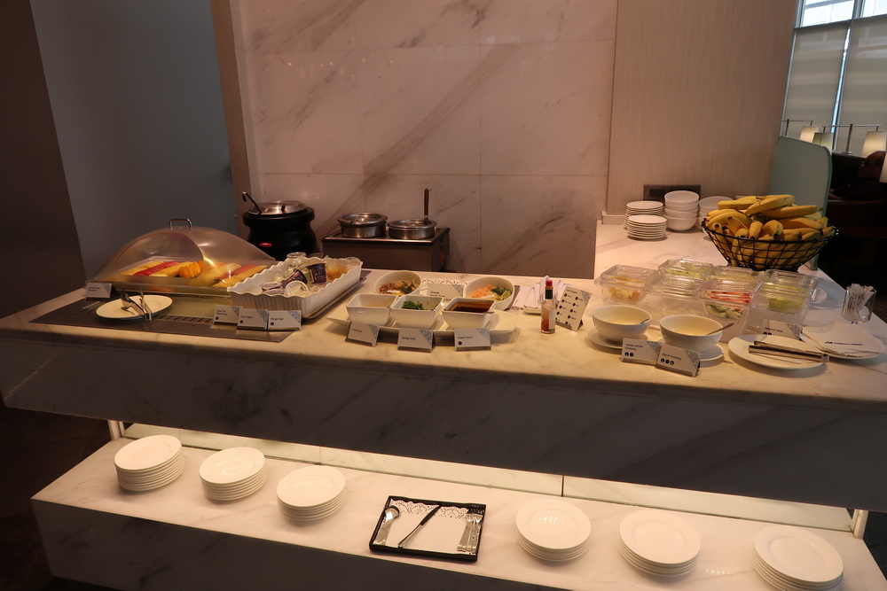 a buffet table with plates and food on it