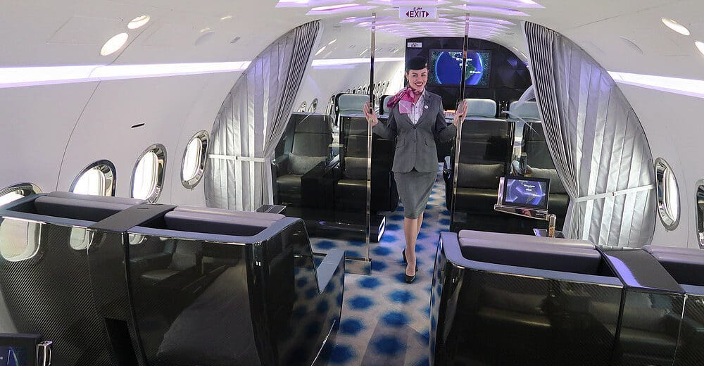 a woman in a suit and scarf standing in a plane