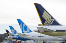 a group of airplanes parked in a row