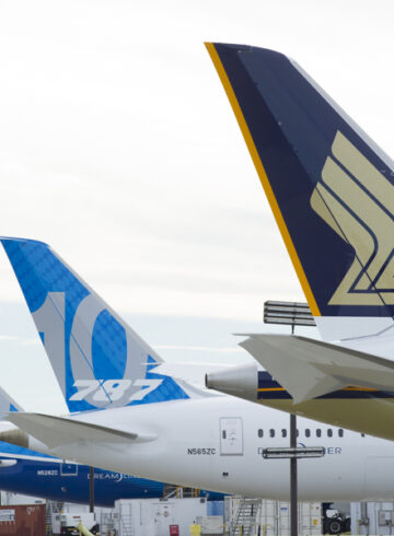 a group of airplanes parked in a row