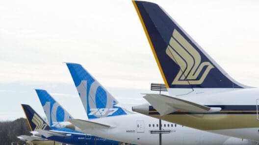 a group of airplanes parked in a row