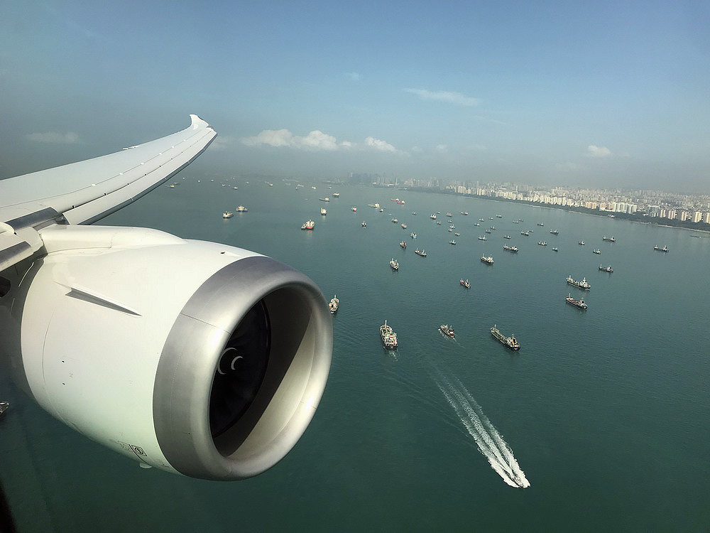a jet engine and boats in the water