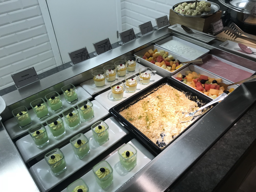 a buffet with food in cups