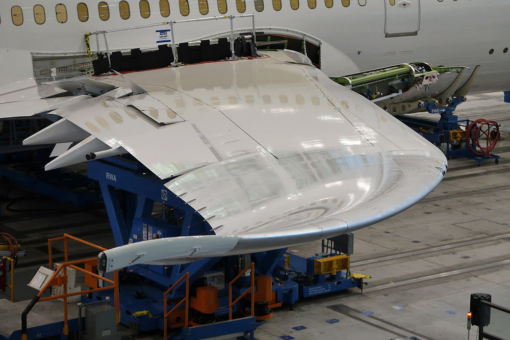 a plane being repaired in a factory