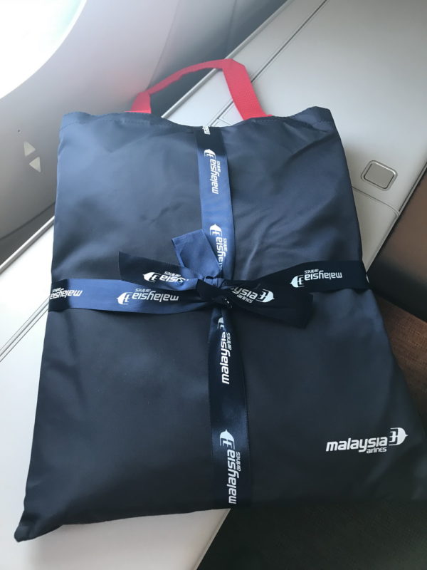 a blue bag with a blue ribbon tied to it
