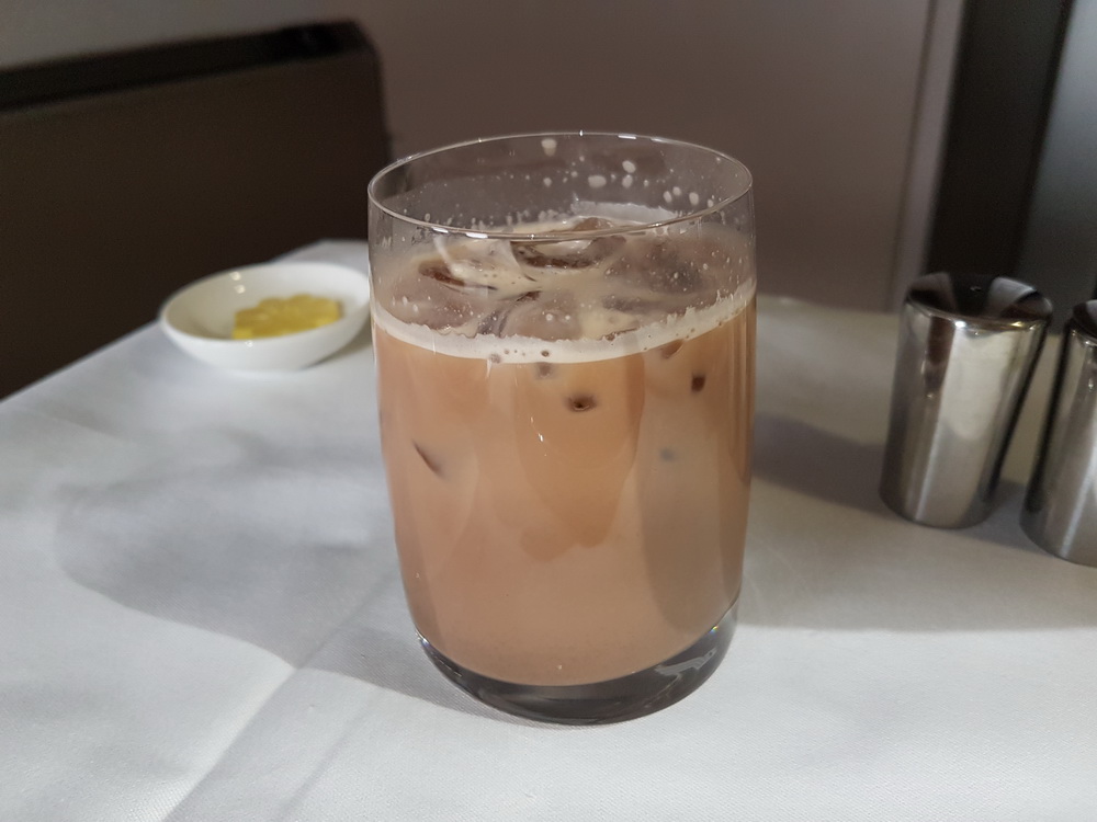 a glass of brown liquid