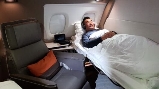 a man lying in a bed