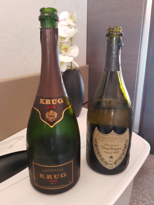 two bottles of champagne on a table