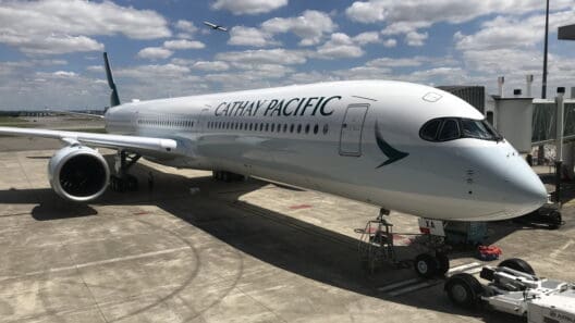 a large white airplane on a concrete surface