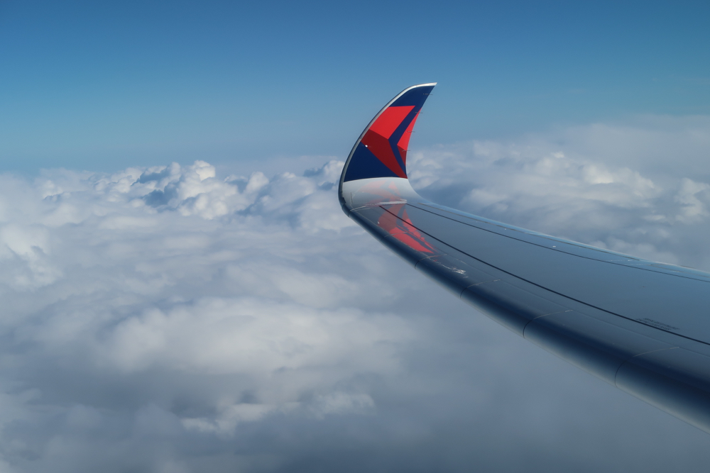 an airplane wing in the sky