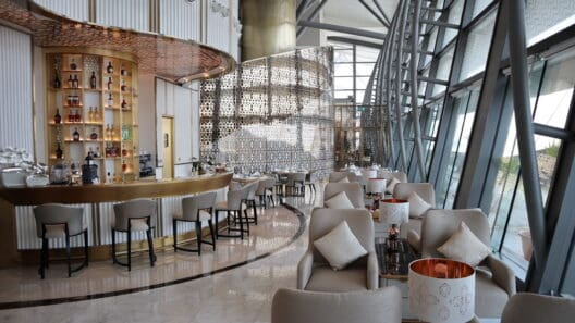 a room with a bar and chairs