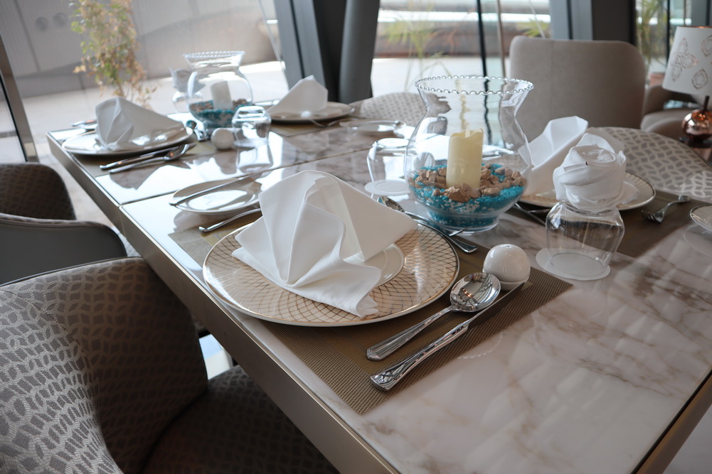 a table with plates and napkins