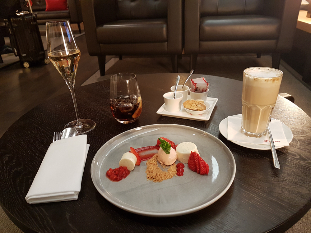 a plate of dessert and drinks on a table