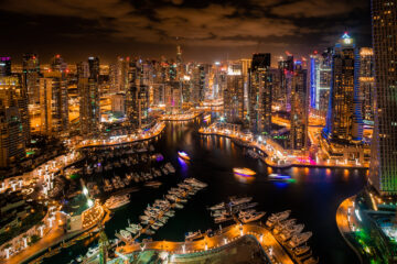 a city with many boats and buildings