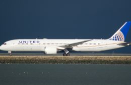 a white airplane on a runway