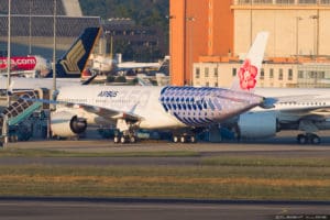 a large white airplane on a runway
